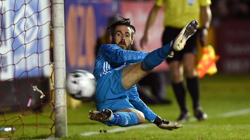 Mark McNulty can only watch as Mikey Drennan scores from the penalty spot for St Pat's