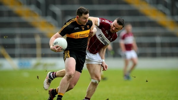 Donal McEligott battles for possession with Dr Crokes' Daithi Casey