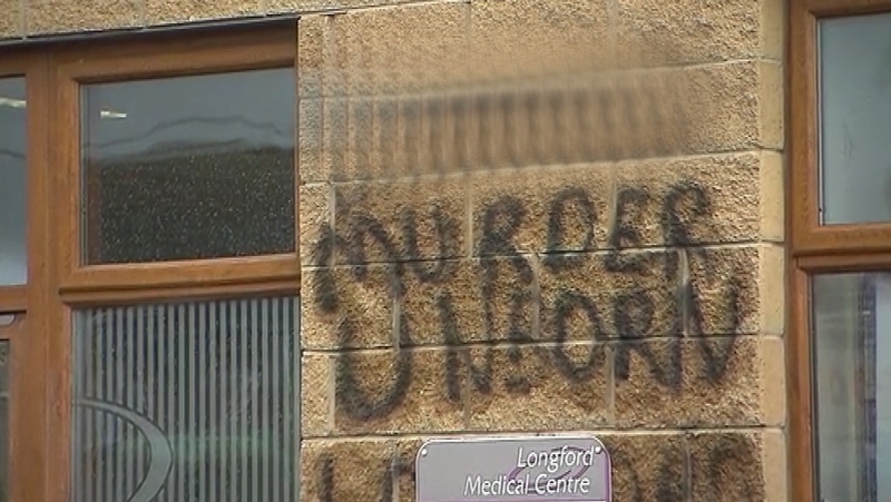 The graffiti was sprayed on a wall outside a doctor's clinic