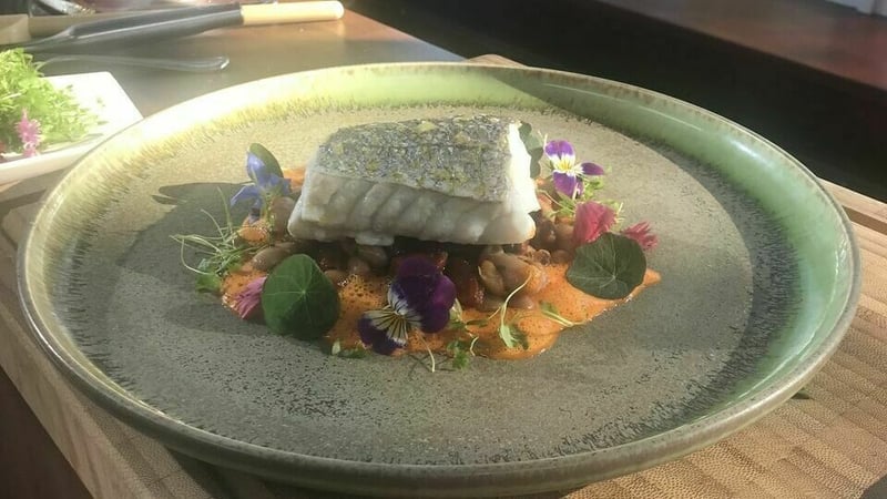 Steamed Hake with Chorizo Cassoulet and Red Pepper Sauce