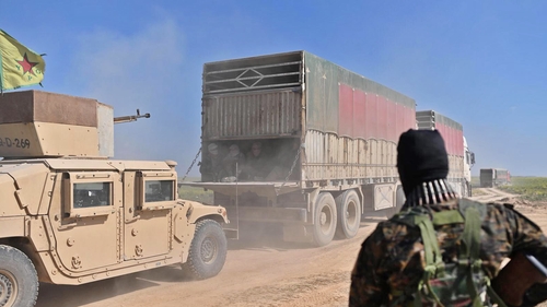 Around 15 trucks carrying men, women and children left the last patch of IS territory in eastern Syria