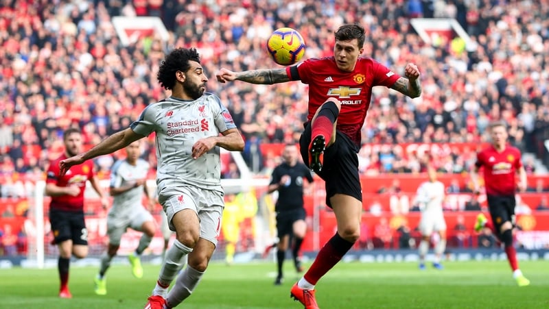 Victor Lindelof (R) in action against Liverpool