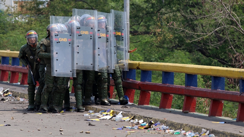 Security forces clash with protesters after an aid vehicle was blocked at the Francisco de Paula Santander Bridge in Tachira, Venezuela