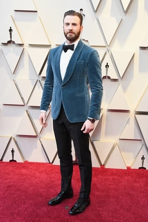 Chris Evans in Salvatore Ferragamo with an IWC watch and Montblanc jewelry.