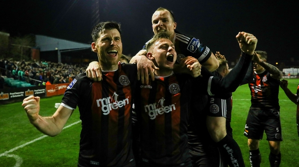 Bohemians players celebrate in front of supporters after Dinny Corcoran scored the only goal against Shamrock Rovers