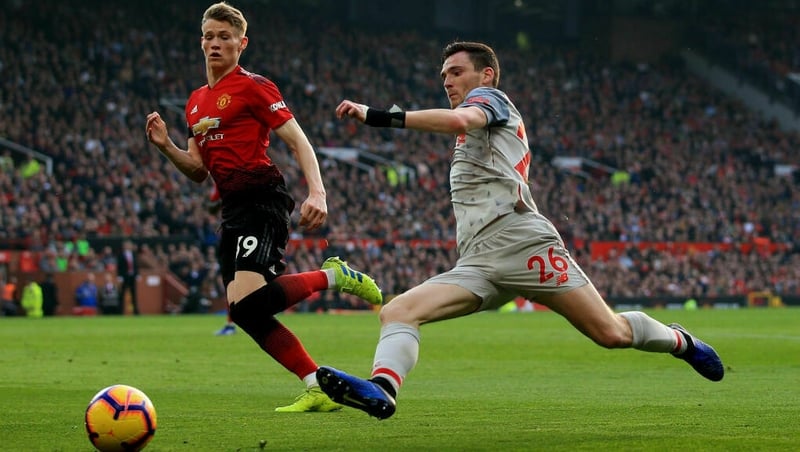 Andy Robertson (R) battles with Man Utd's Scott McTominay