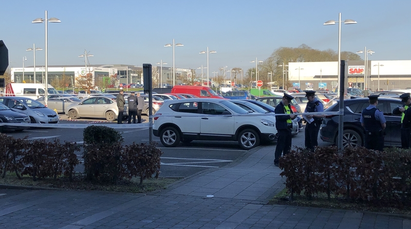 The man was shot as he sat in his car