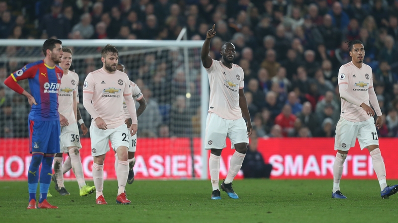 Romelu Lukaku salutes the travelling United fans after scoring against Palace