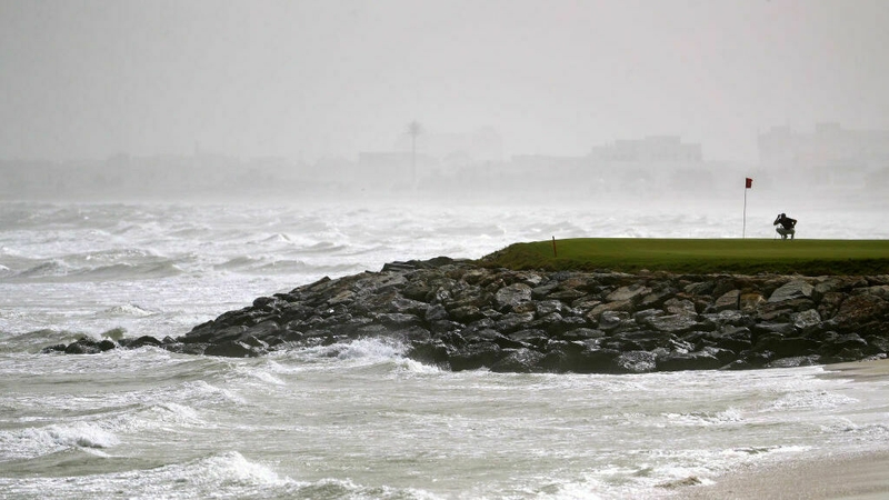 A player lines up a putt on the 13th green