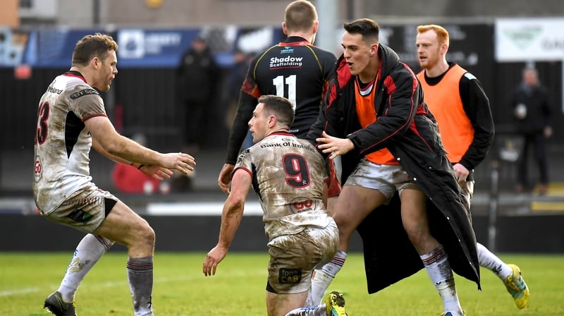 John Cooney celebrates his try