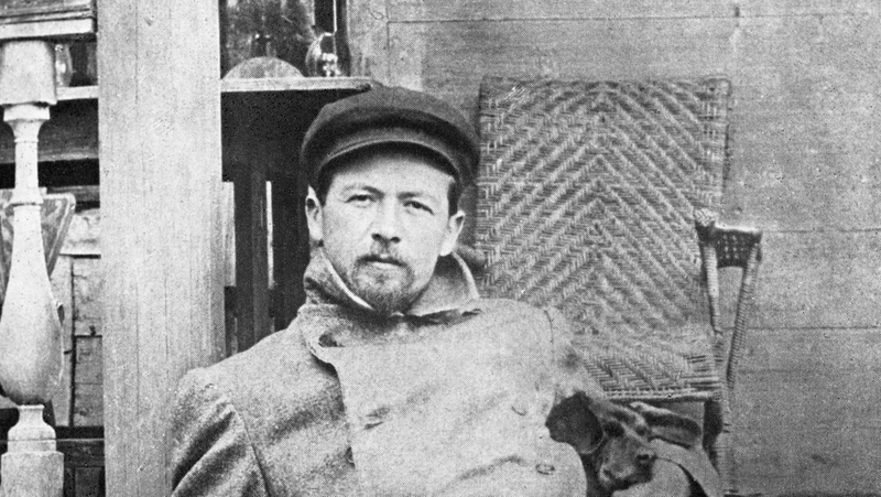 A youthful Anton Chekhov, reclining on steps