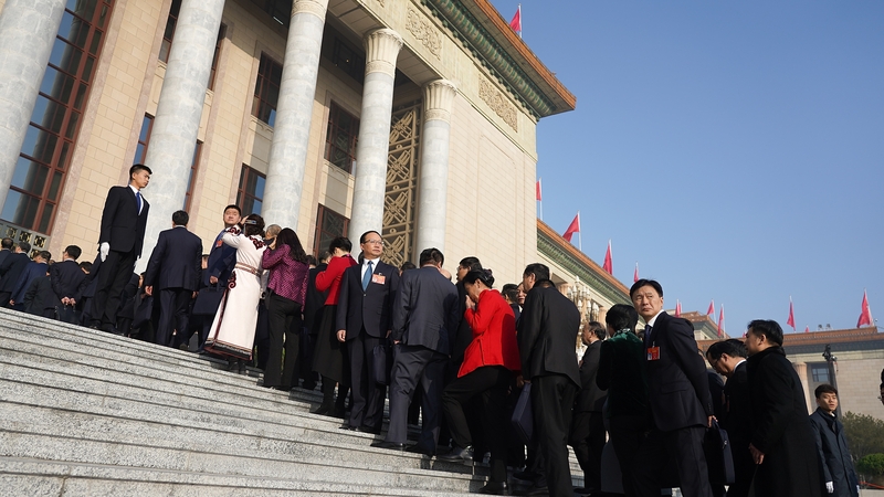 Delegates file into the Great Hall of the People in Beijing