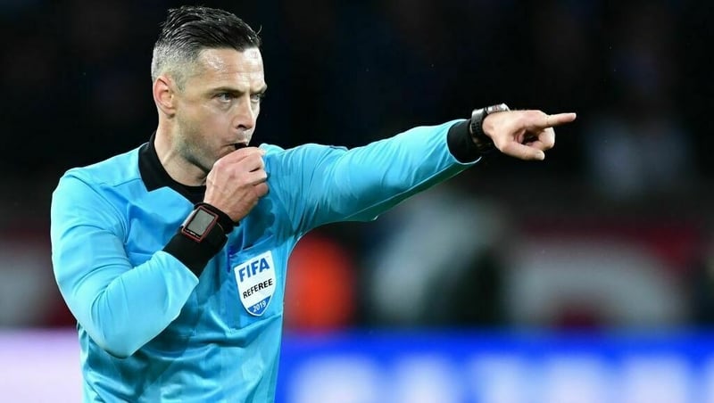 Referee Damir Skomina points at the penalty spot at Parc des Princes