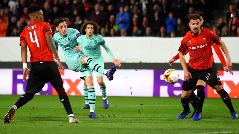 Mesut Ozil takes a shot