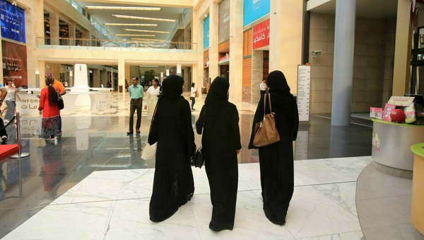 Saudi women wearing the veil and abaya