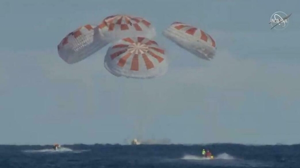Live footage from NASA showed the capsule splashing down into the ocean