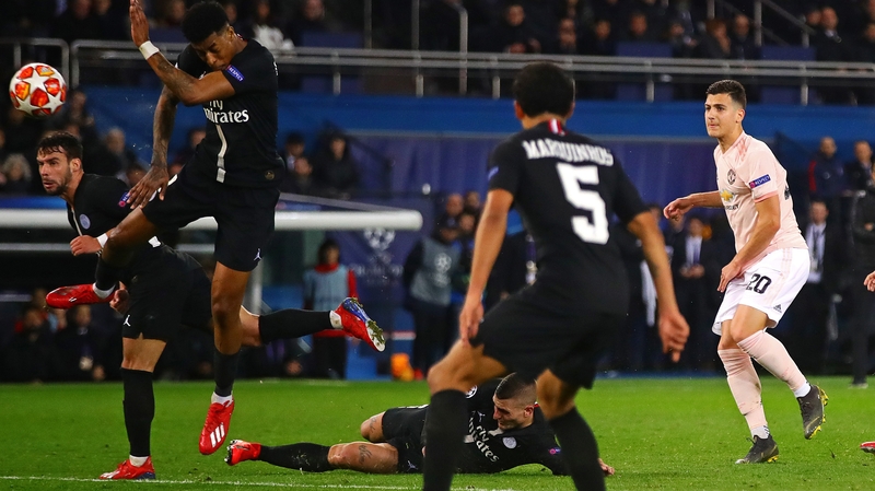 Presnel Kimpembe (far left_ was penalised for handball after Diogo Dalot's shot clipped his arm