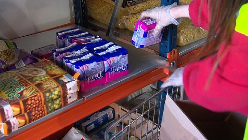 Sanitary towels being stacked at Crosscare food bank in Glasnevin