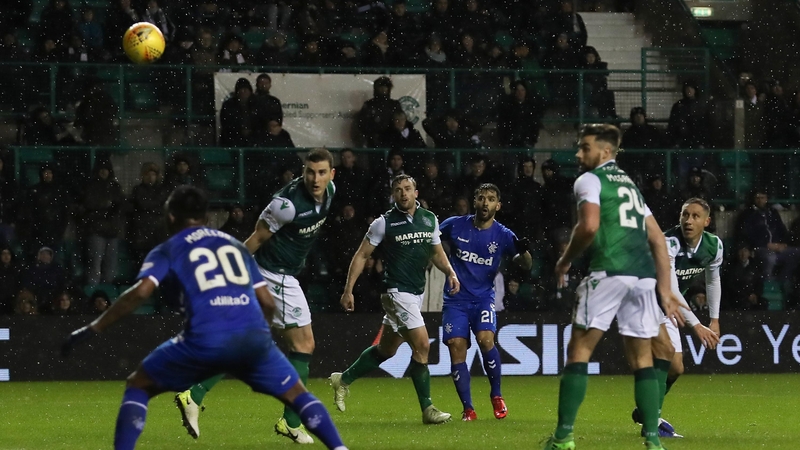 A fan leapt from the home end to confront Hibs skipper James Tavernier on the stroke of half-time