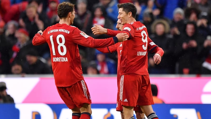 Robert Lewandowski celebrates his second goal with Leon Goretzka and Franck Ribery