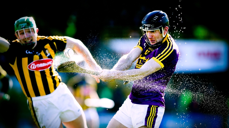 Water sprays of Liam Óg McGovern's hurl as he shoots