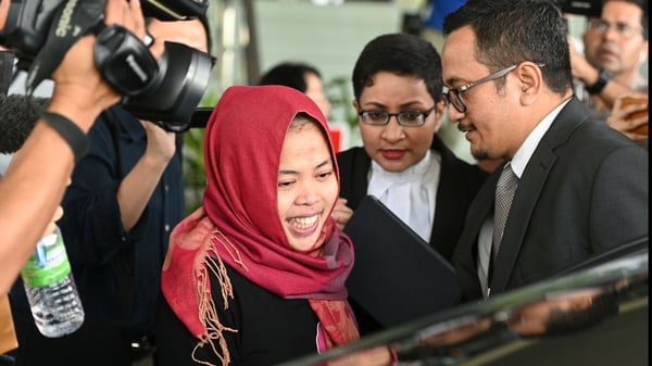 Indonesian woman Siti Aisyah smiles while leaving the court in Malaysia