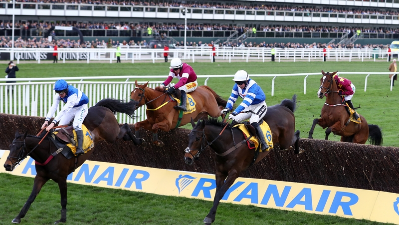Bryony Frost on her way to victory in the Ryanair Chase on Frodon (l)
