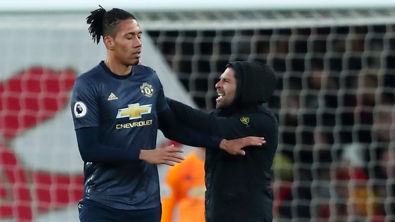 Gary Cooper, who confronted Smalling, has since been arrested and charged with common assault and encroaching on to the playing area