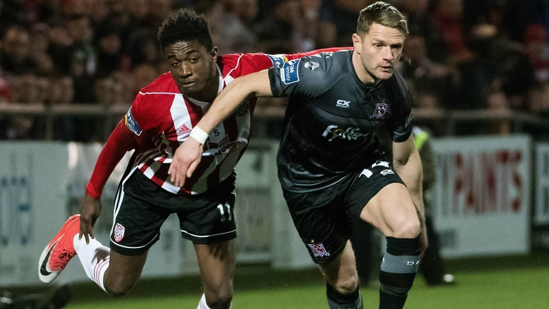 Derry City's Junior Ogedi-Uzokwe (L) tangles with Dane Massey