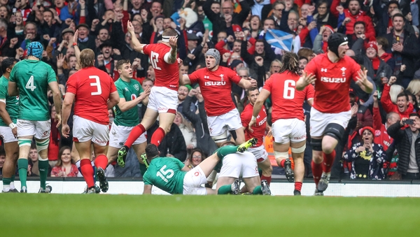 Hadleigh Parkes goes over for an early Welsh try