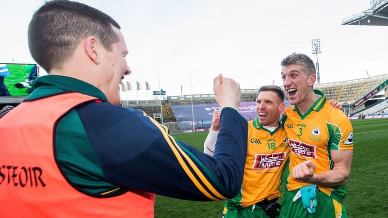 Corofin's Kieran Fitzgerald (R) celebrates with manager Kevin O'Brien (L) and Ciaran McGrath