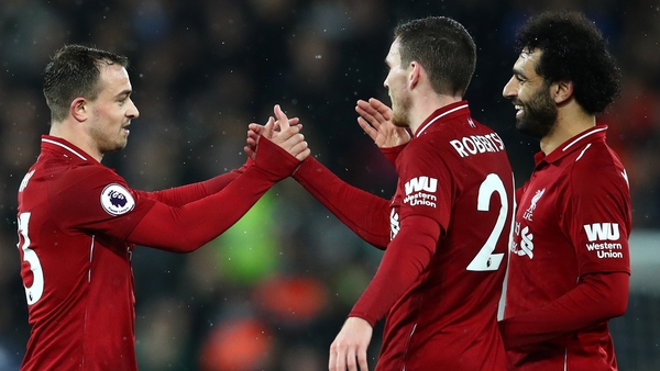 Shaqiri (left) and Robertson (centre) with Liverpool team-mate Mo Salah
