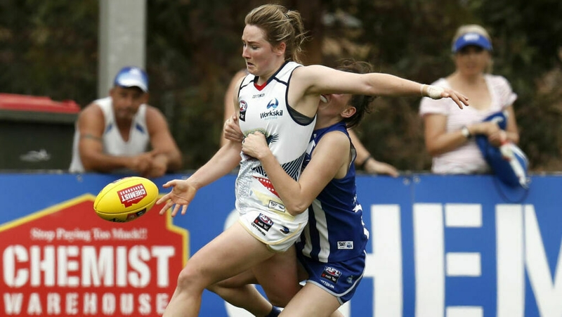 Ailish Considine of the Crows is tackled by Jasmine Grierson of the Kangaroos