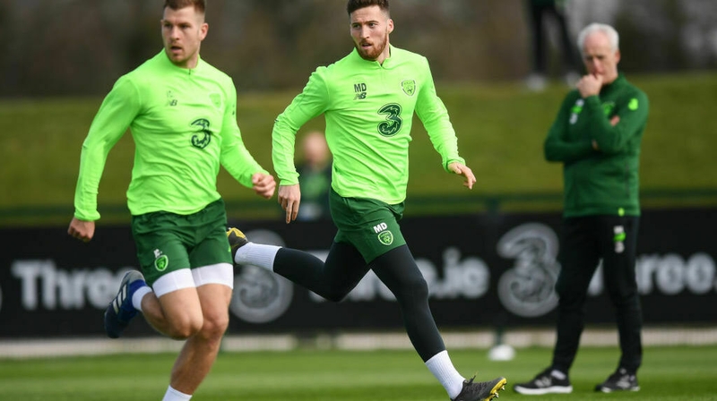 Matt Doherty (C) and James Collins (L) train under the watchful eye of Mick McCarthy