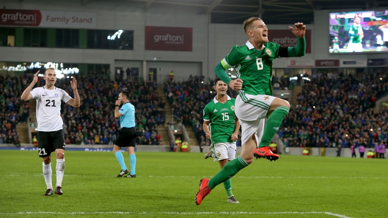 Steven Davis celebrates his second-half penalty against Estonia at Windsor Park