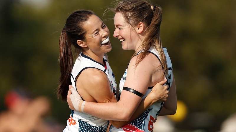 Sophie Li (left) celebrates with Ailish Considine