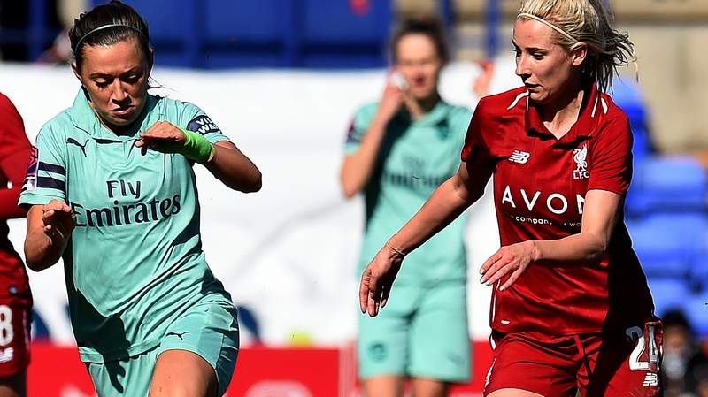 Kirsty Linnett of Liverpool is tracked by Katie McCabe