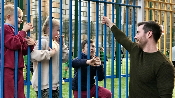 Macauley chats to some local kids on Sheriff Street