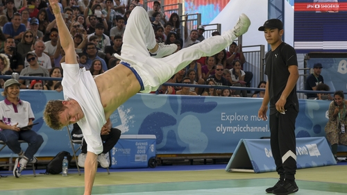 Russia's b-boy Bumblebee (L) competes against Japan's b-boy Shigelix during a battle at the Youth Olympic Games in Buenos Aires