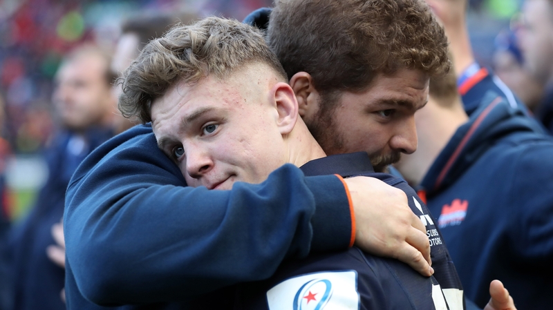 A dejected Darcy Graham is consoled after the game