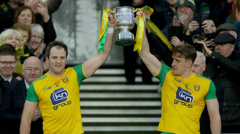Michael Murphy and Hugh McFadden lift the trophy