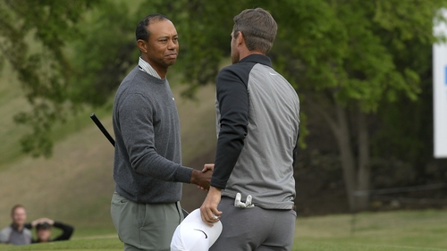 Lucas Bjerregaard of Denmark shakes hands with Tiger Woods