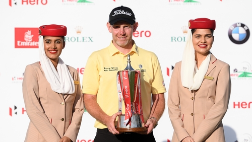 Stephen Gallacher poses with the trophy