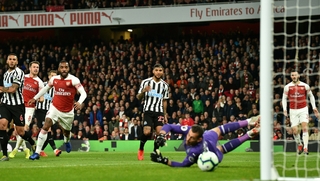 Aaron Ramsey steers home the opener for Arsenal