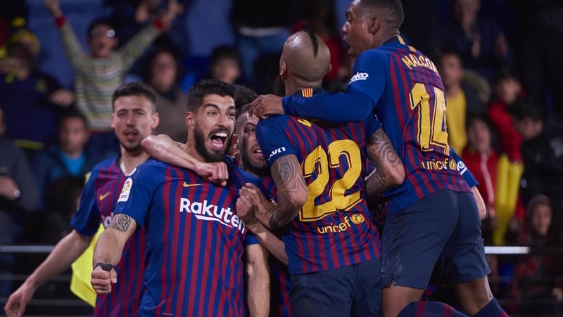 Luis Suarez is mobbed after his dramatic leveller