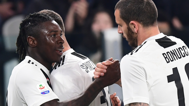 Juventus' Italian forward Moise Kean (L) with Leonardo Bonucci