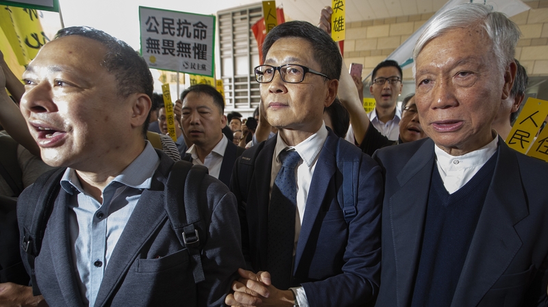 Occupy Central activists (L-R) Benny Tai, Dr Chan Kin-man and Reverend Chu Yiu-ming on their way to court