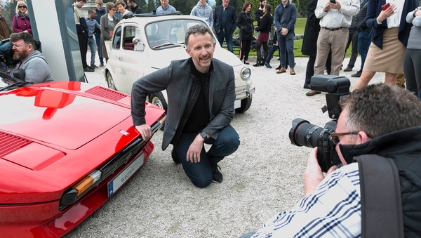 Norman Crowley with cars converted into electric vehicles by Electrifi