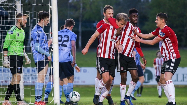 Goal scorer Greg Sloggett is congratulated by Derry City team-mates