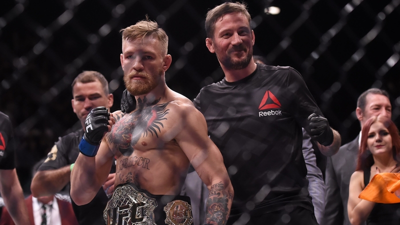 John Kavanagh (R) with Conor McGregor after the fighter won the UFC featherweight belt in 2015